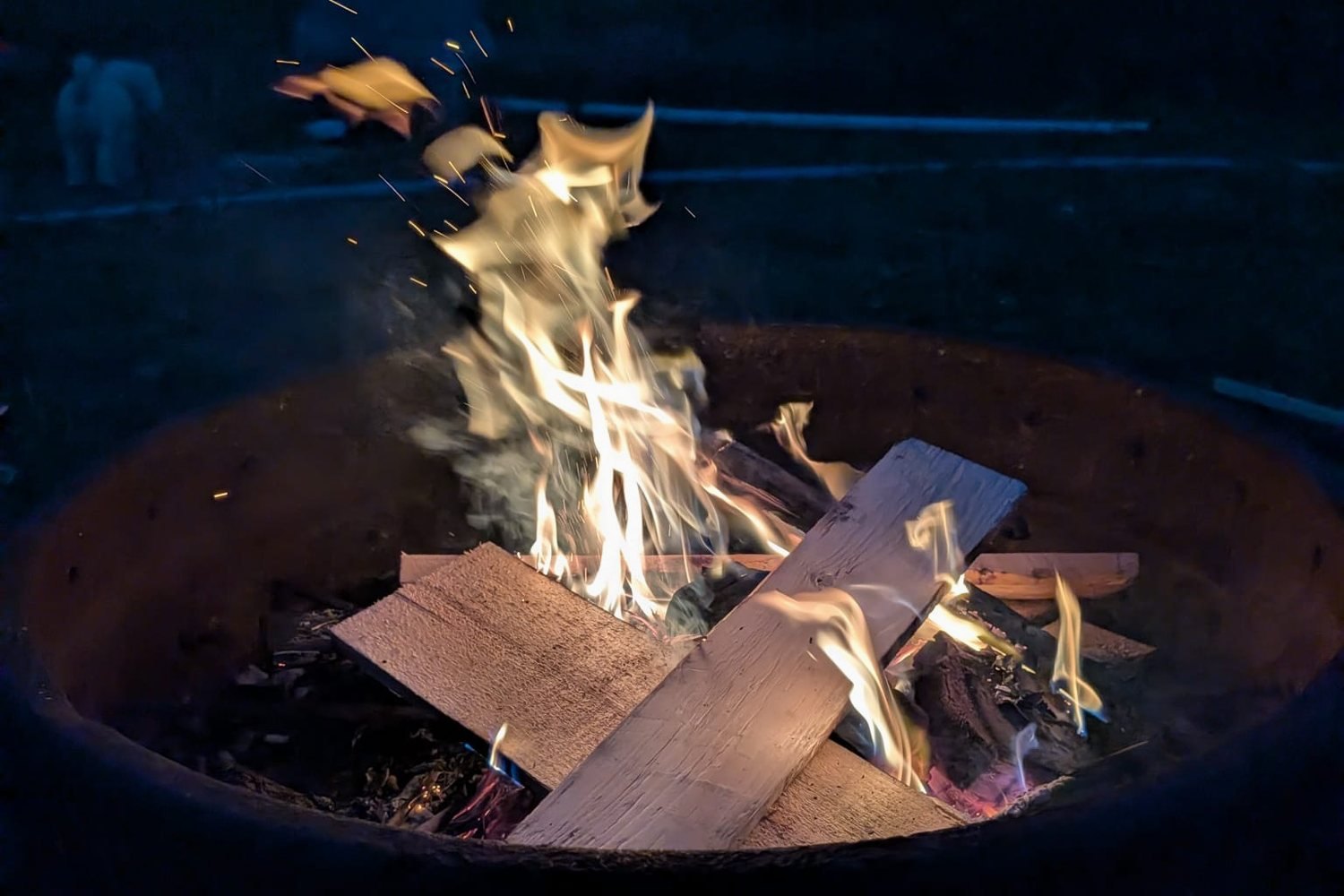 The fire pit burning at dusk